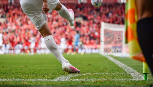 Footballer taking a corner. Stats tracked for performance trends. STATZO app is a grassroots stats app